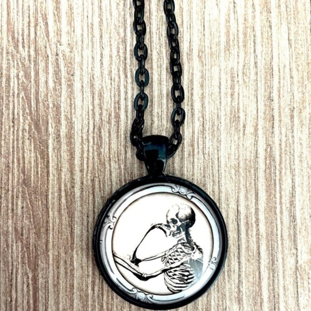 Pensive Skeleton Necklace, NWT